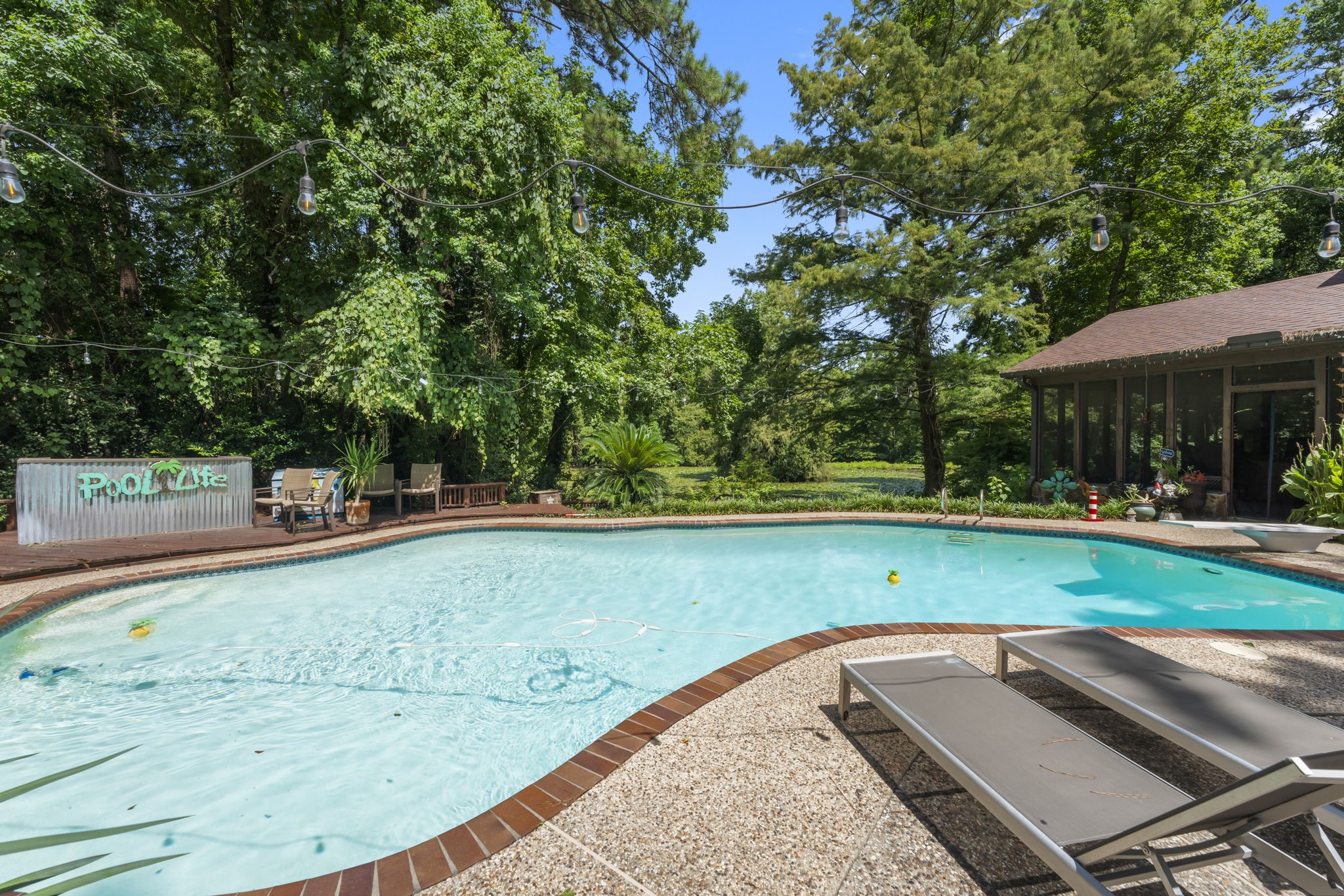 426 Nursery Road The Woodlands, TX 77380 - Photo 19 of 41 a view of a swimming pool with a patio
