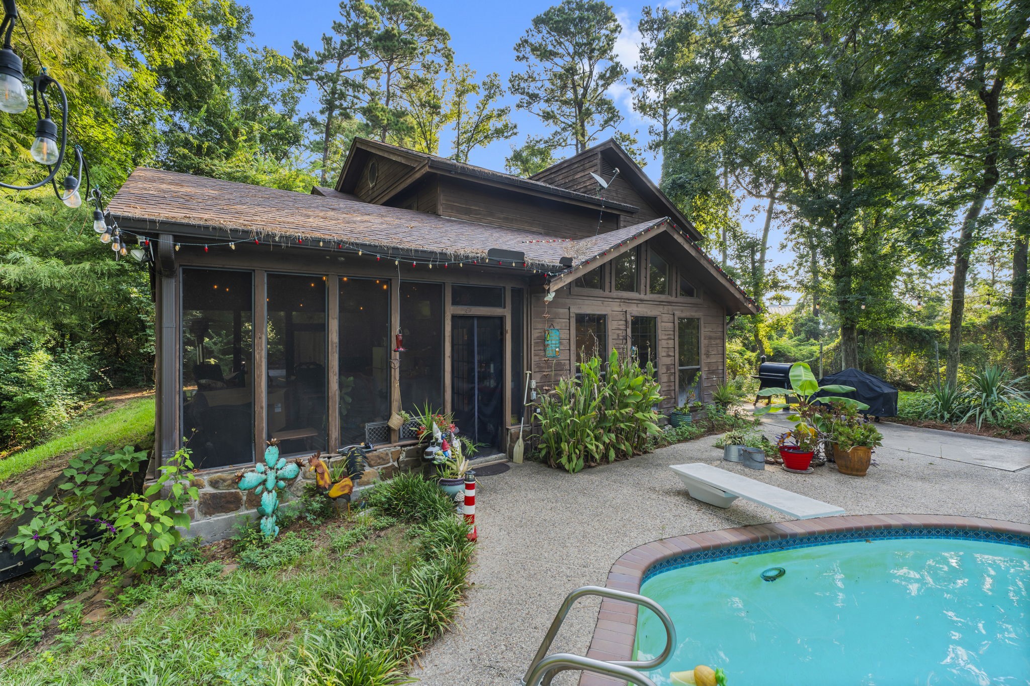 426 Nursery Road The Woodlands, TX 77380 - Photo 22 of 41 a front view of a house with garden