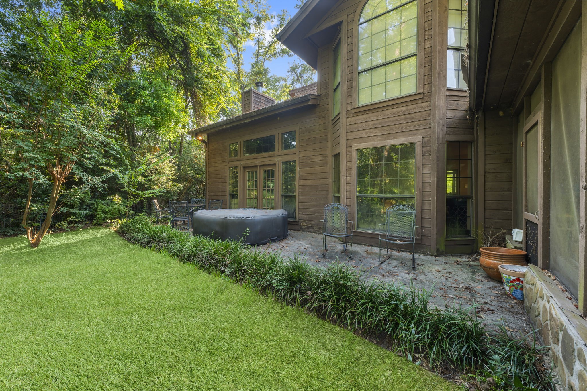426 Nursery Road The Woodlands, TX 77380 - Photo 25 of 41 a view of an house with backyard space and garden