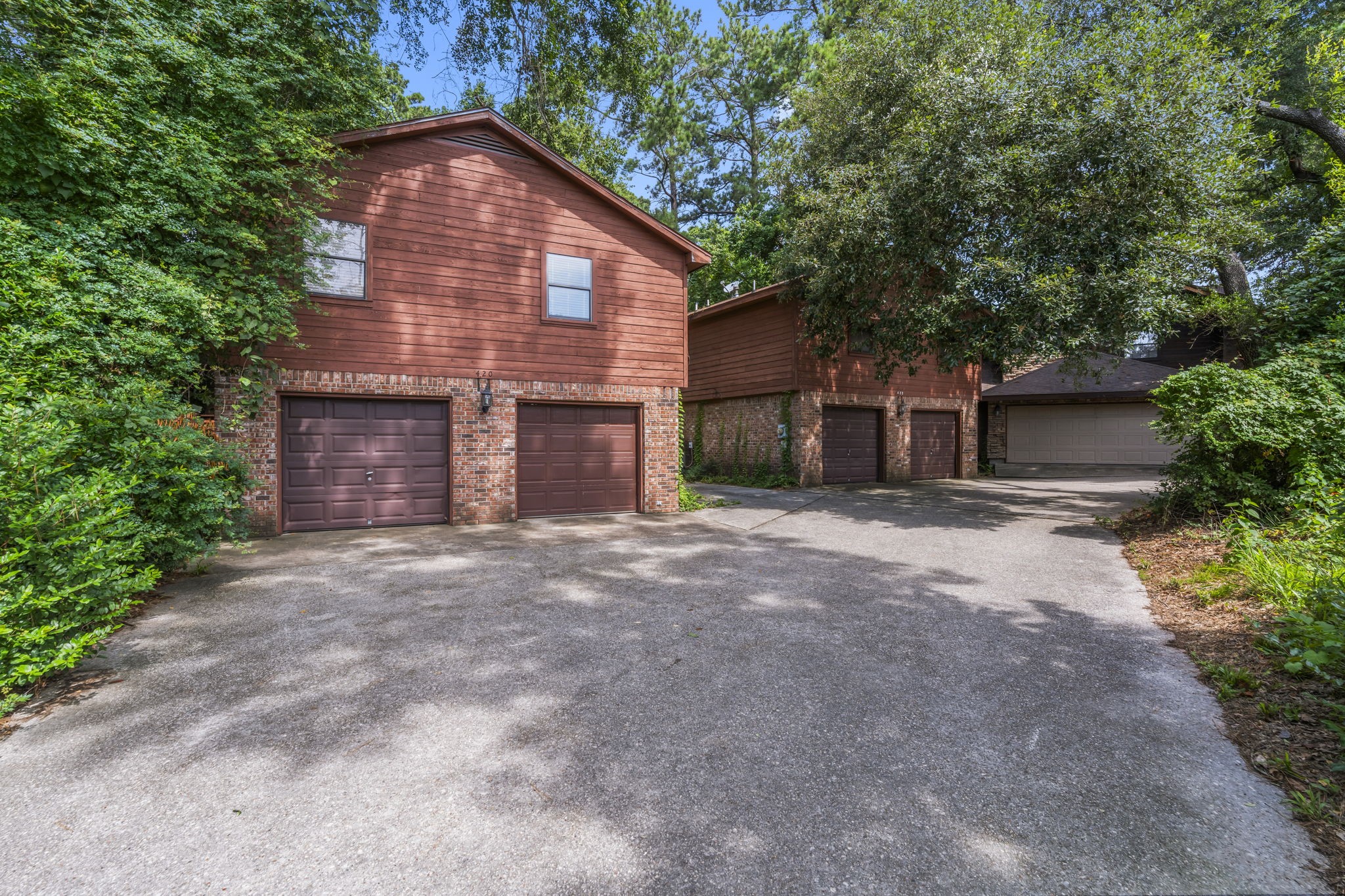 426 Nursery Road The Woodlands, TX 77380 - Photo 6 of 41 a view of a house with a yard and garage