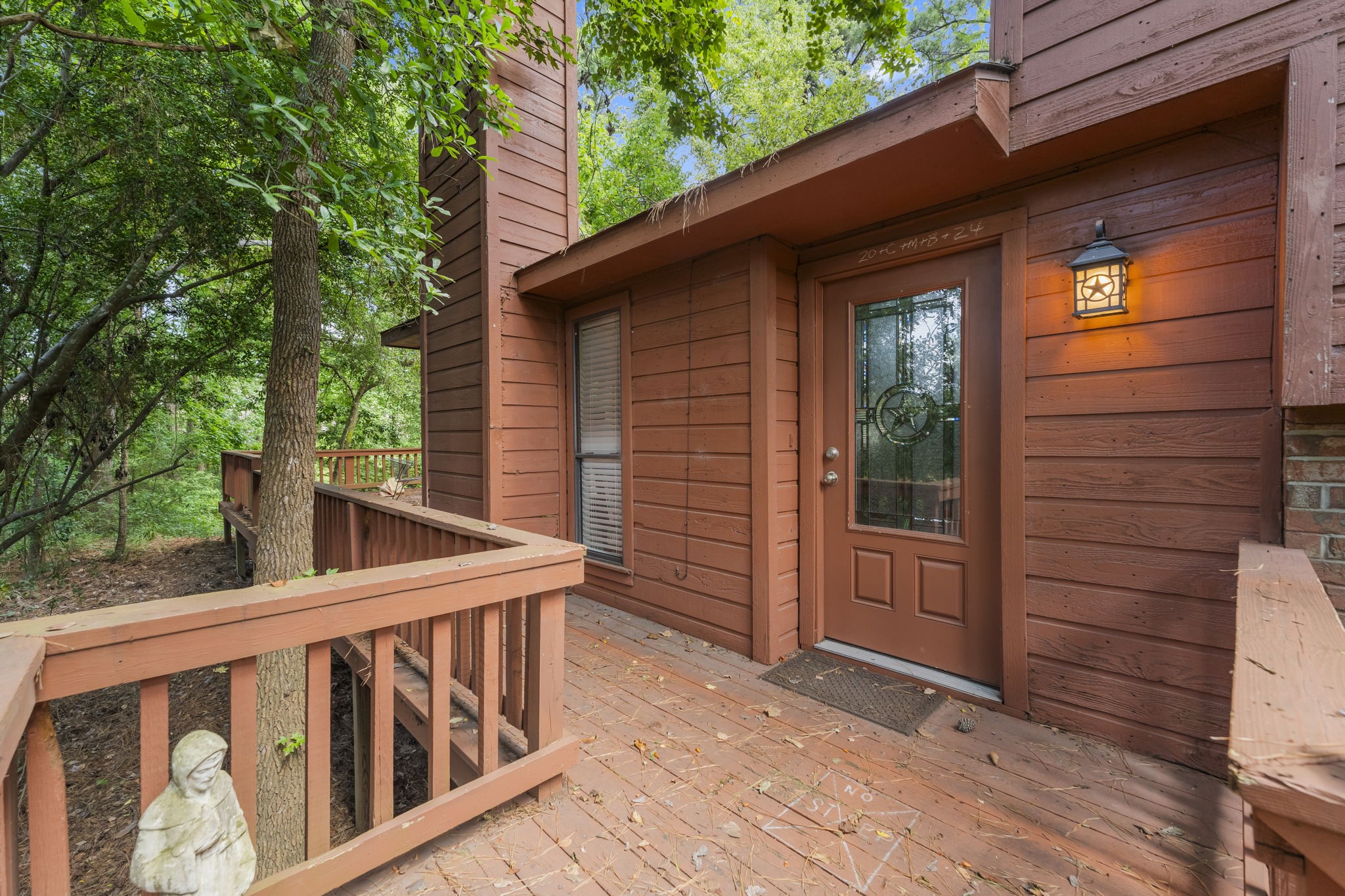 426 Nursery Road The Woodlands, TX 77380 - Photo 8 of 41 a view of wooden balcony