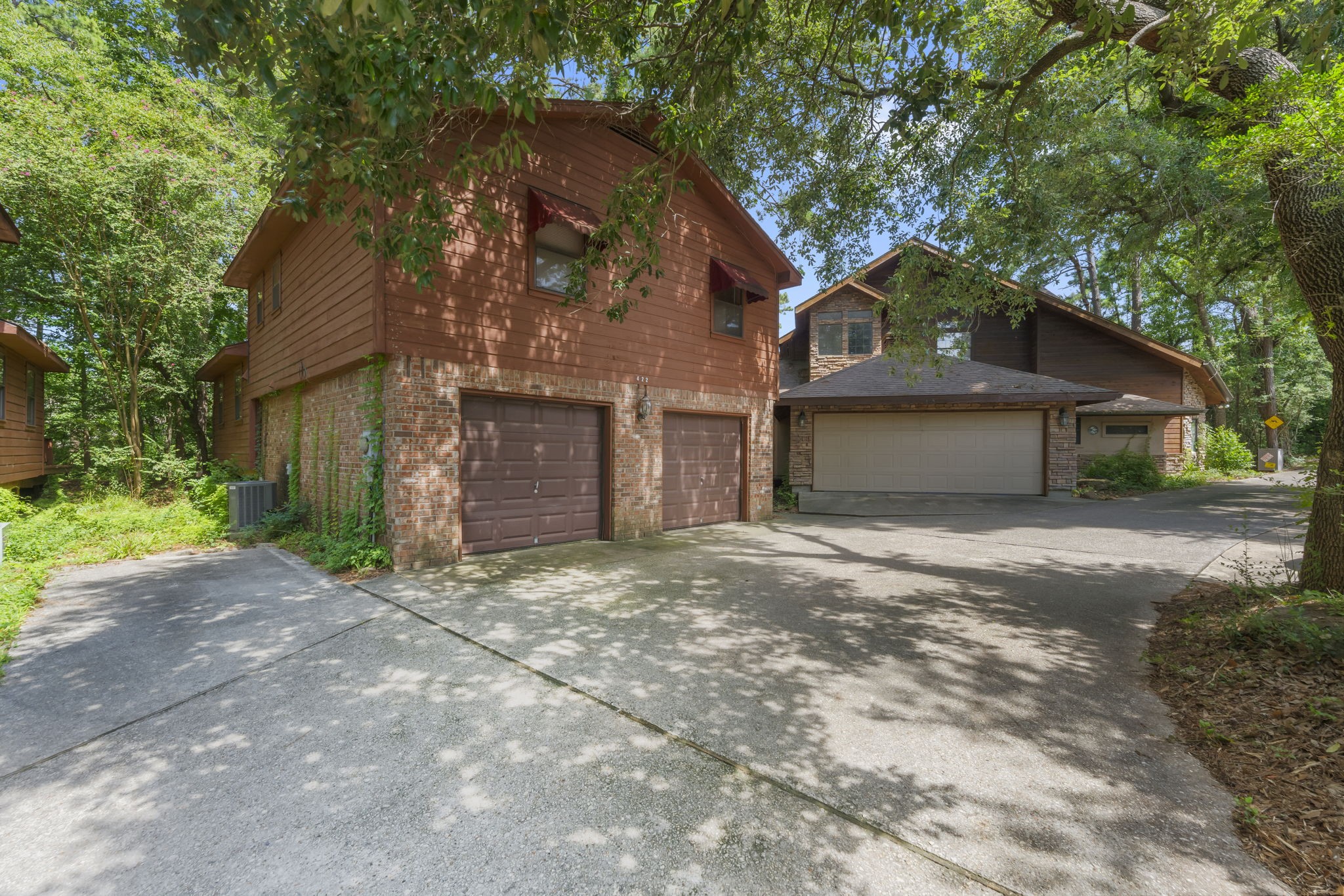 426 Nursery Road The Woodlands, TX 77380 - Photo 9 of 41 a front view of a house with a yard and garage