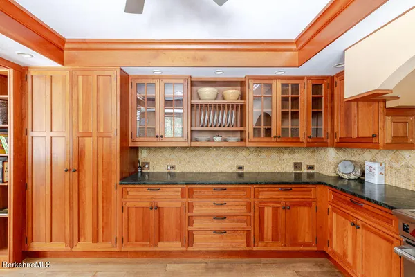 a view of a house with a yard covered in snow