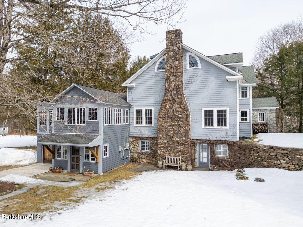 17 Cronk Road Monterey, MA 01245 - Photo 57 of 65 a front view of a house with a yard covered in snow