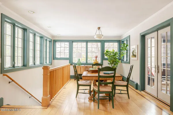 a view of a dining room with furniture window and wooden floor