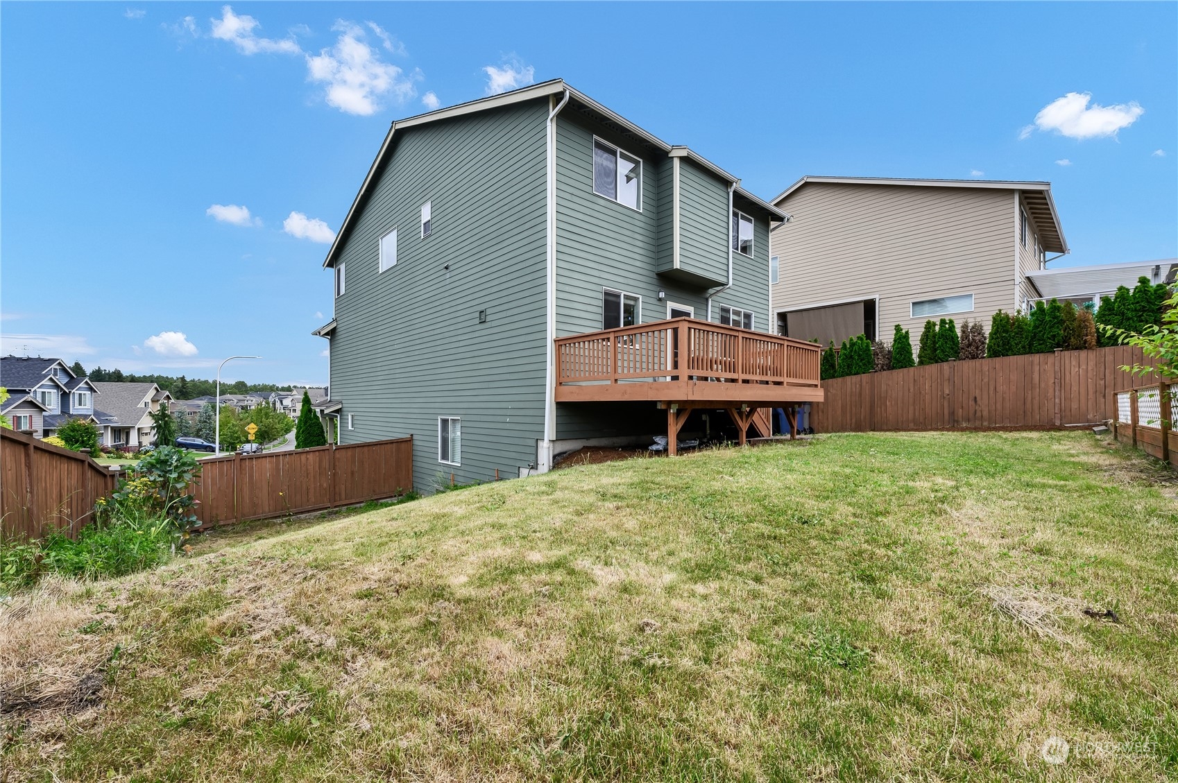 1118 Southwest 338th Street Federal Way, WA 98023 - Photo 25 of 25 a front view of a house with a yard and a garage