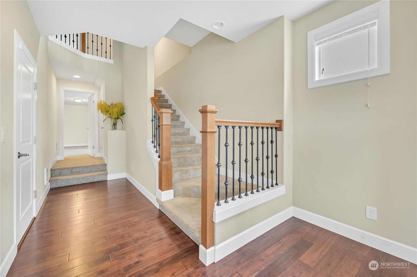 1118 Southwest 338th Street Federal Way, WA 98023 - Photo 3 of 25 a view of a hallway with wooden floor and windows