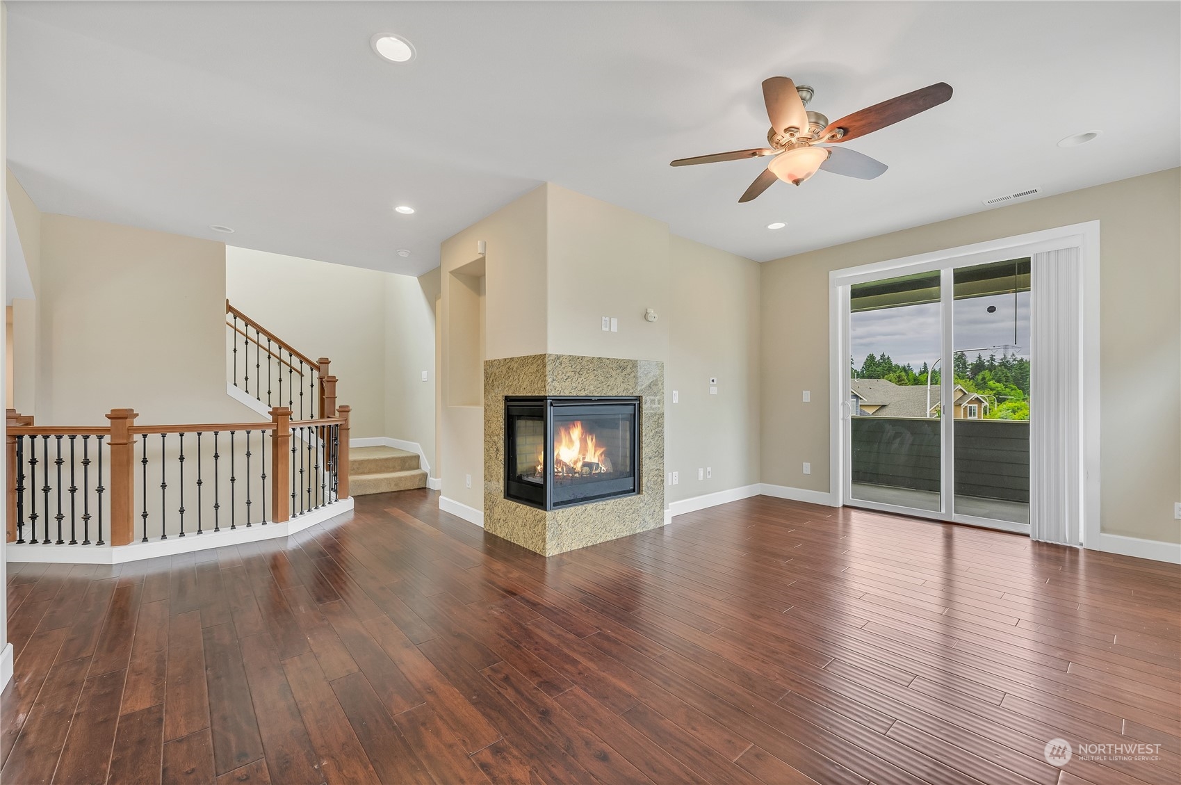 1118 Southwest 338th Street Federal Way, WA 98023 - Photo 7 of 25 a view of an empty room with wooden floor fireplace and a window