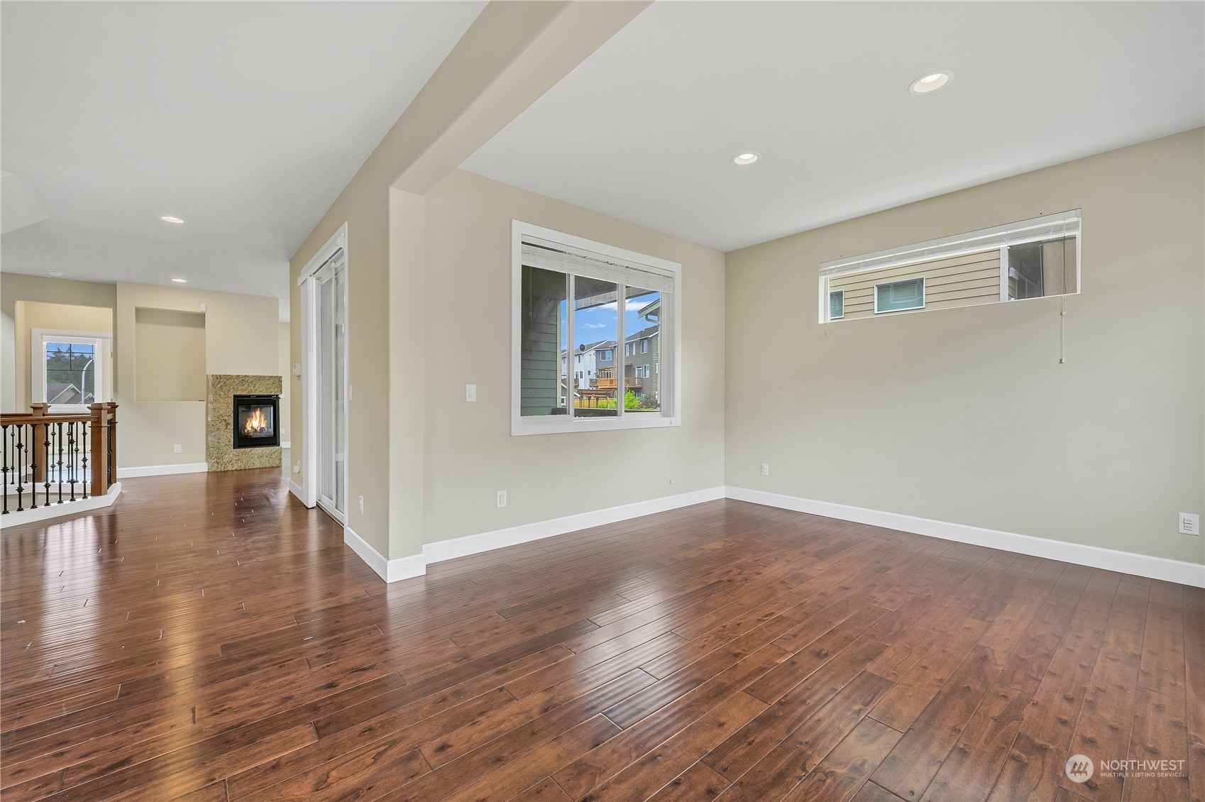1118 Southwest 338th Street Federal Way, WA 98023 - Photo 8 of 25 a view of an empty room with wooden floor and a window