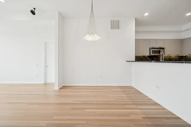 a view of a kitchen from the hallway