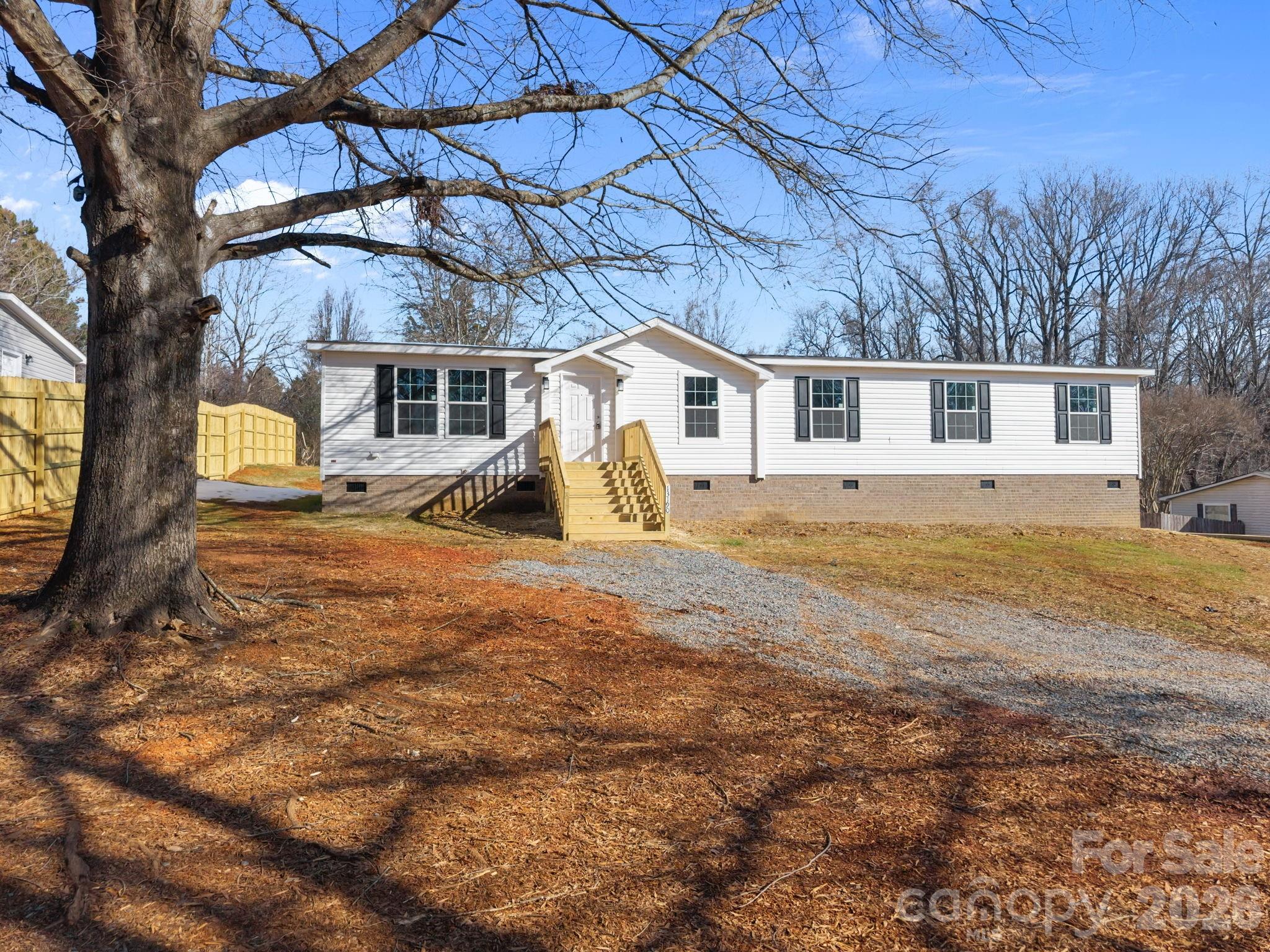 13190 Old Beatty Ford Road Rockwell, NC 28138 - Photo 4 of 23 a view of a house with a yard