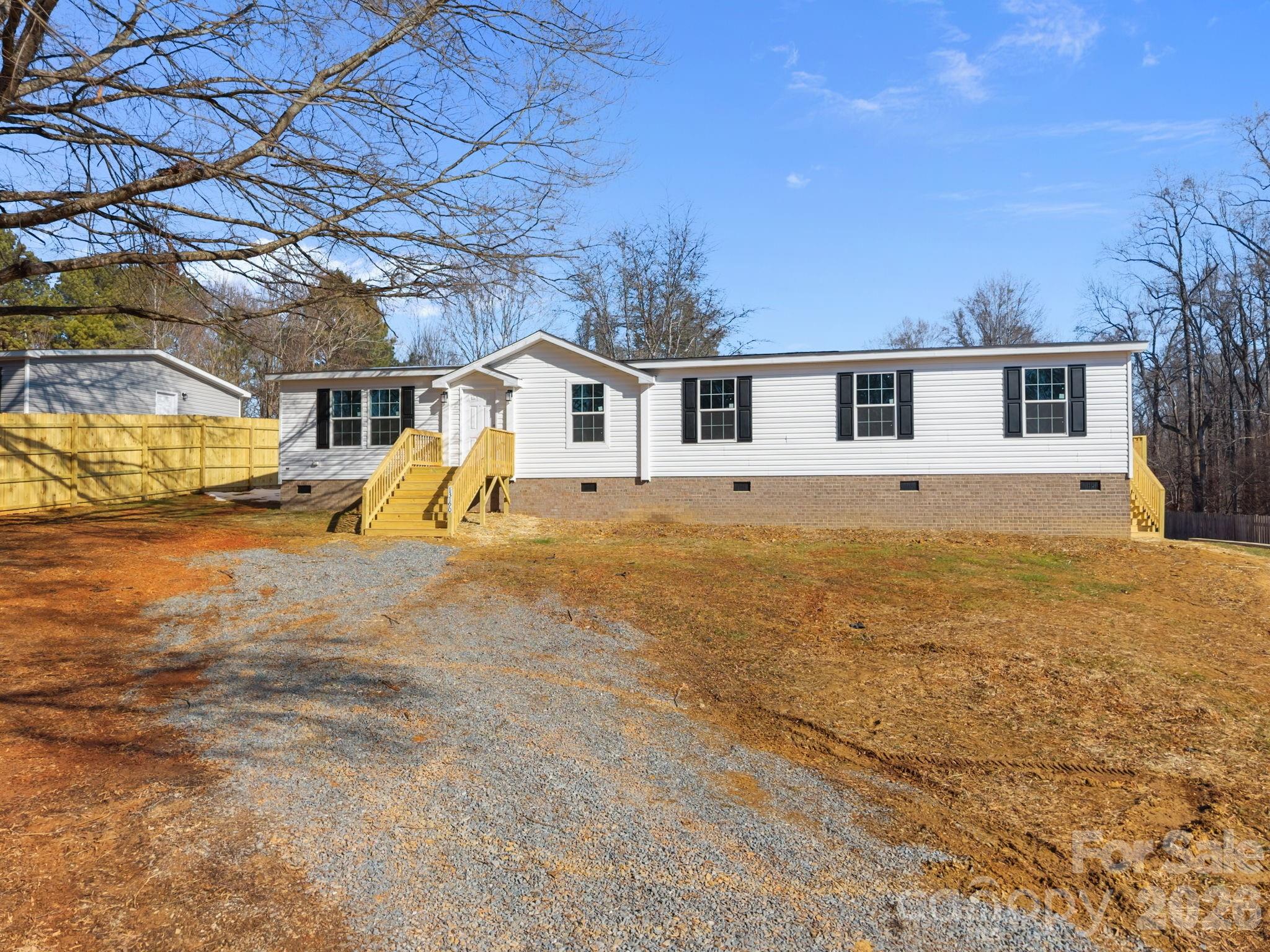 13190 Old Beatty Ford Road Rockwell, NC 28138 - Photo 5 of 23 a view of a yard in front of house