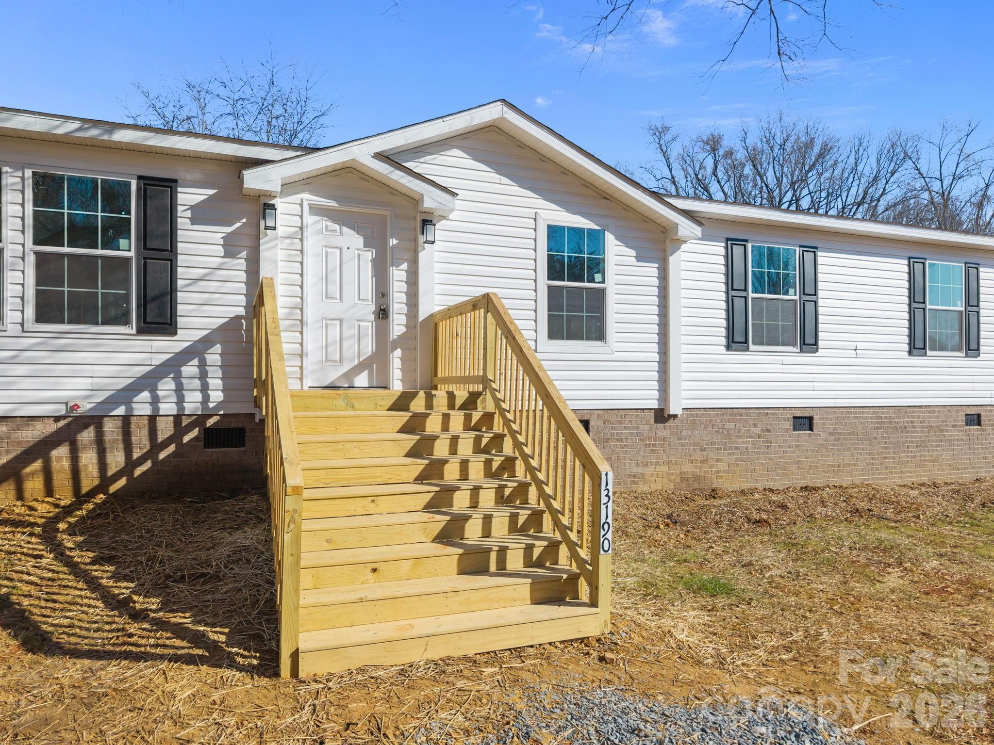 13190 Old Beatty Ford Road Rockwell, NC 28138 - Photo 6 of 23 a view of a house with a balcony