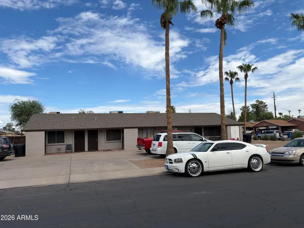 a view of a cars park in front of house