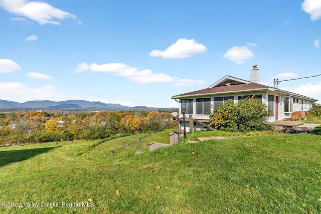 a front view of house with yard and seating