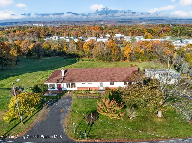 an aerial view of a house with a garden