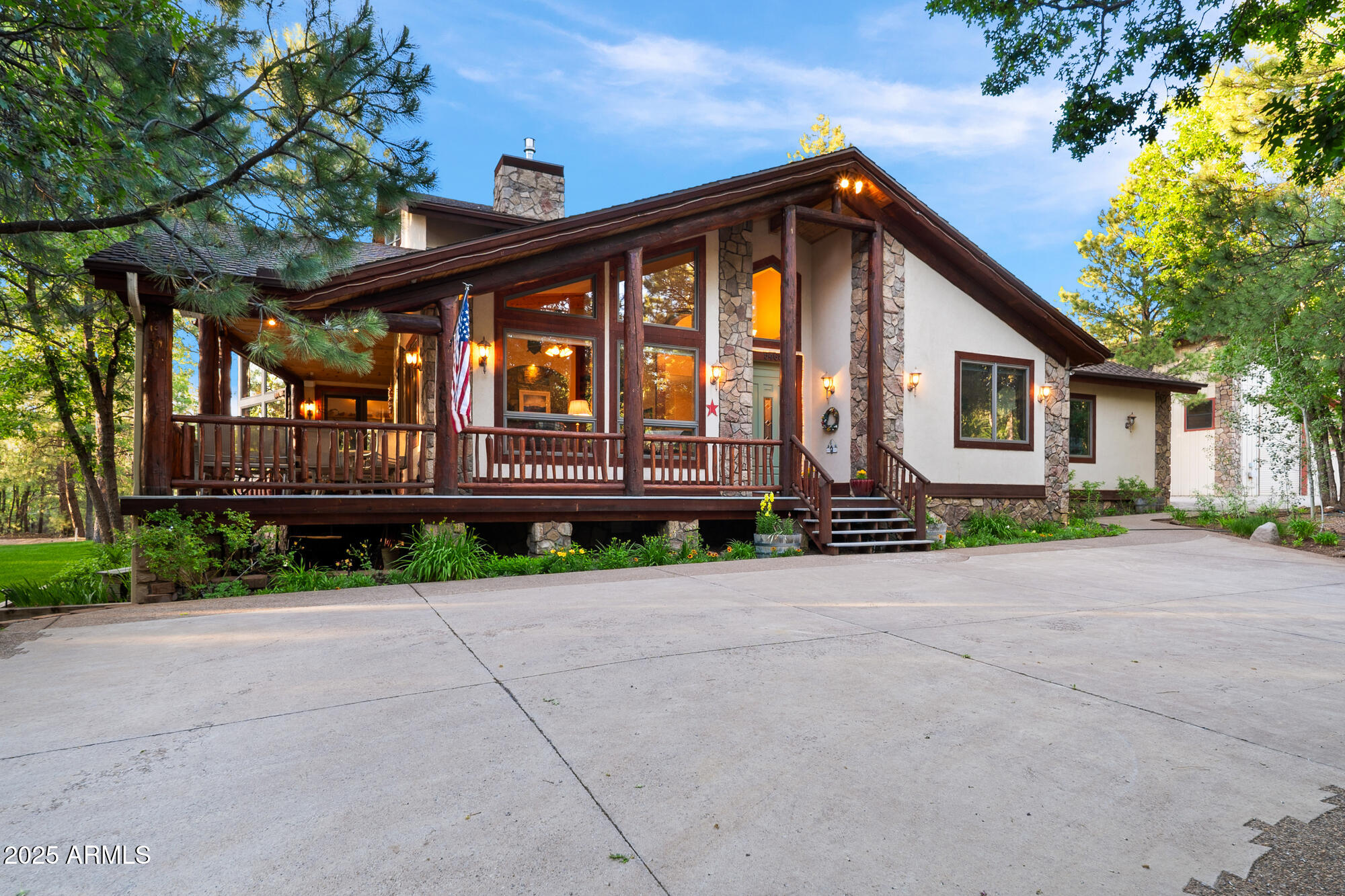 5468 Apache Trail Pinetop, AZ 85935 - Photo 13 of 73 a front view of a house with a yard and garage