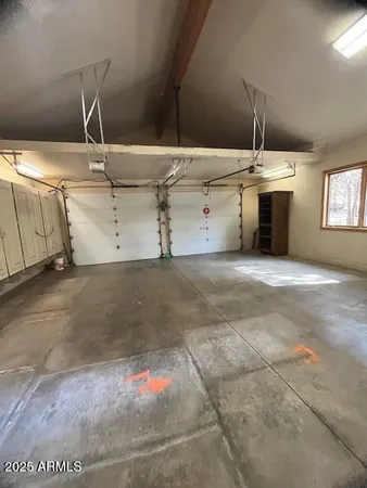 a living room with furniture a fireplace and a large window