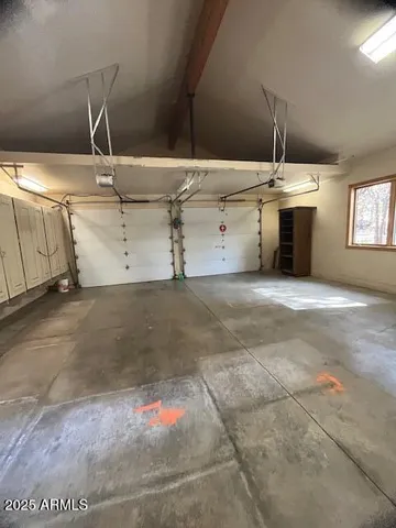 a living room with furniture a fireplace and a large window