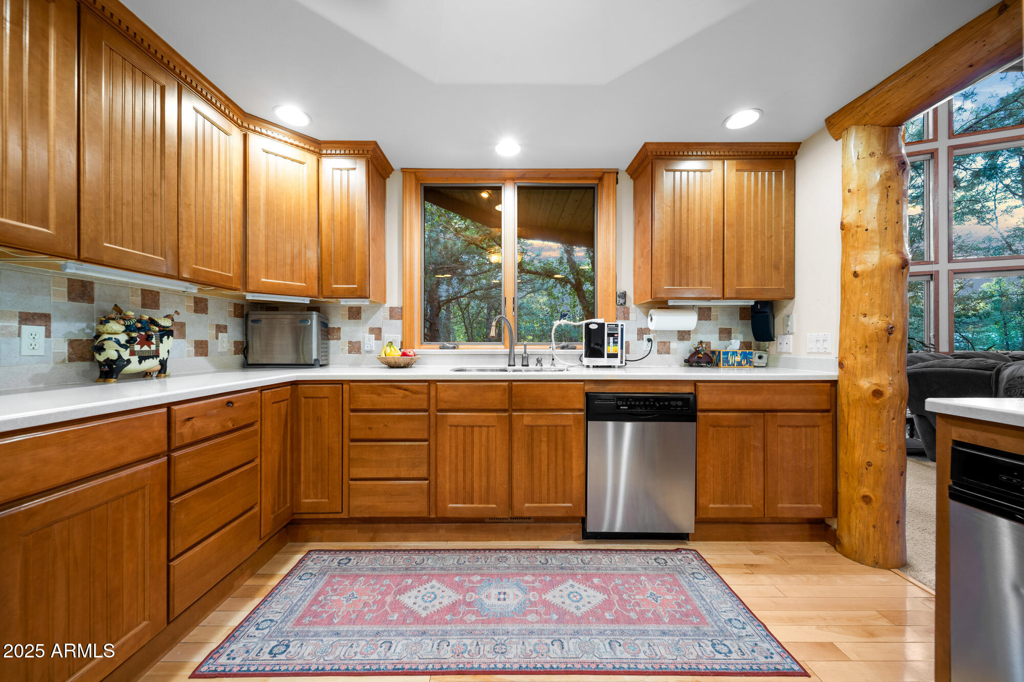 5468 Apache Trail Pinetop, AZ 85935 - Photo 31 of 73 a kitchen with stainless steel appliances granite countertop wooden cabinets a sink and dishwasher
