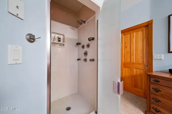 a bathroom with a sink a toilet and shower curtain