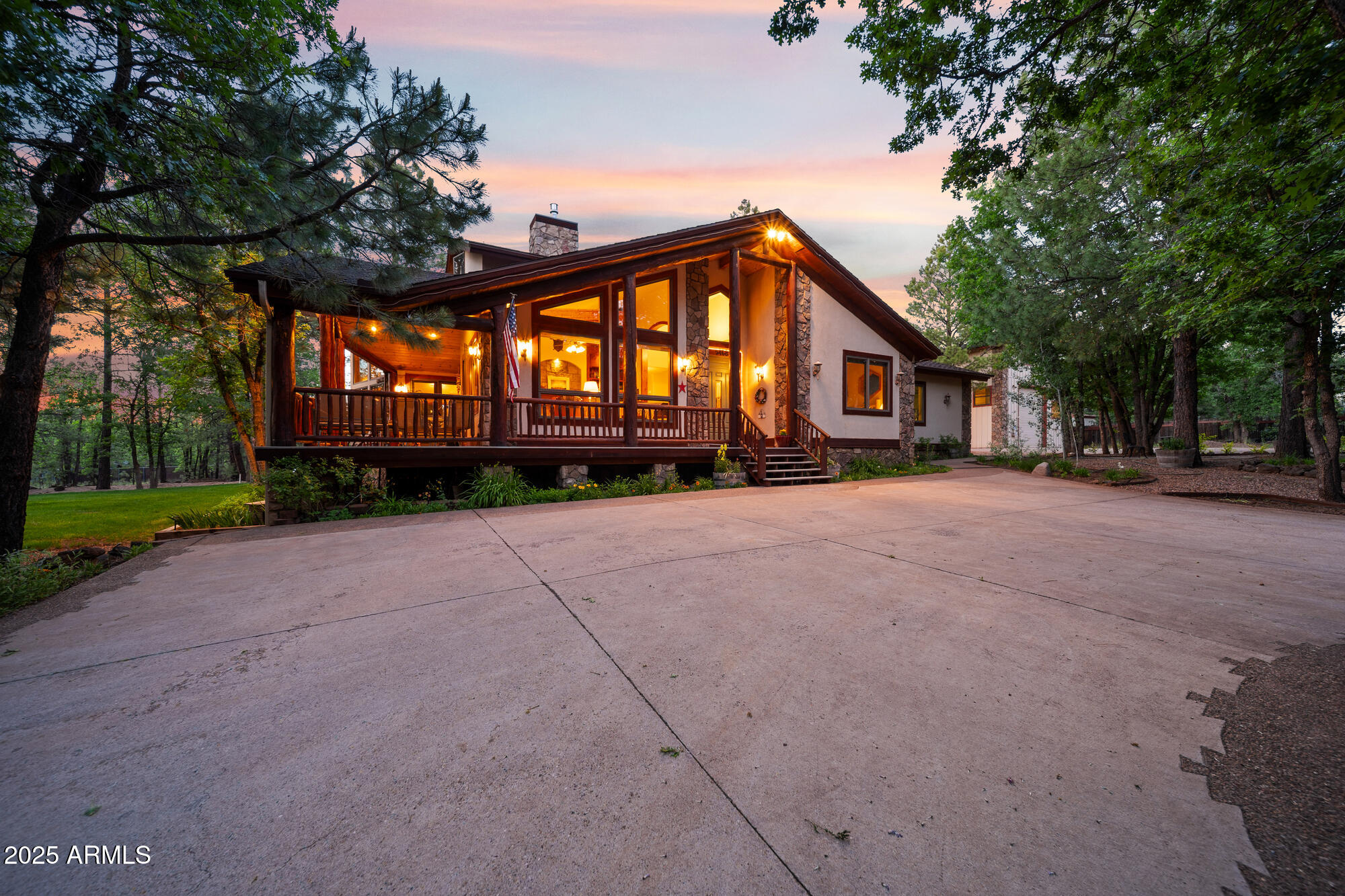 5468 Apache Trail Pinetop, AZ 85935 - Photo 5 of 73 a front view of a house with a yard and garage