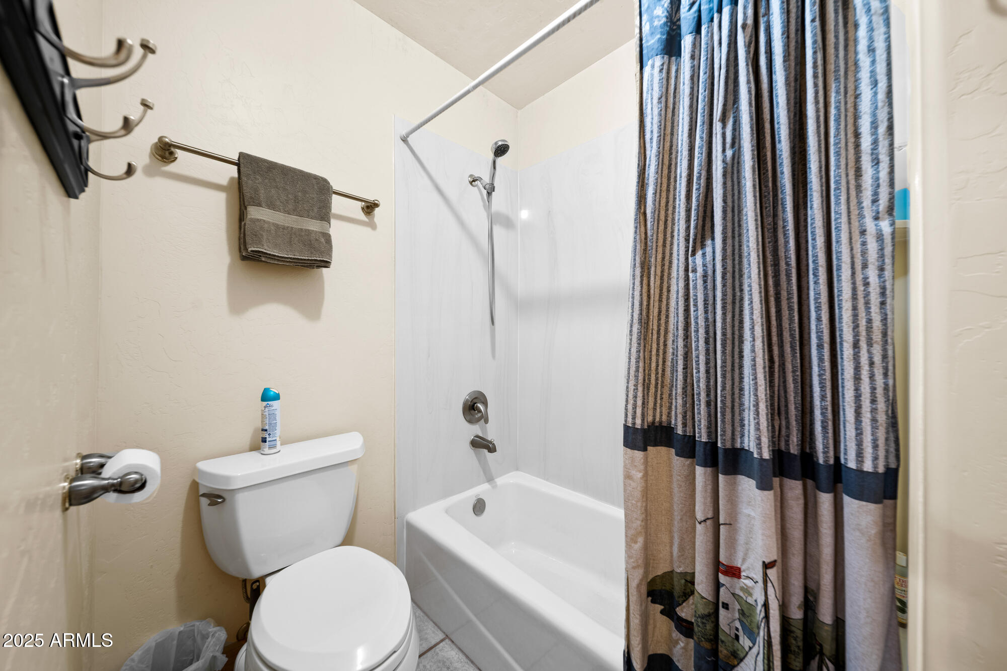 5468 Apache Trail Pinetop, AZ 85935 - Photo 52 of 73 a white toilet sitting next to a bathroom sink and tub