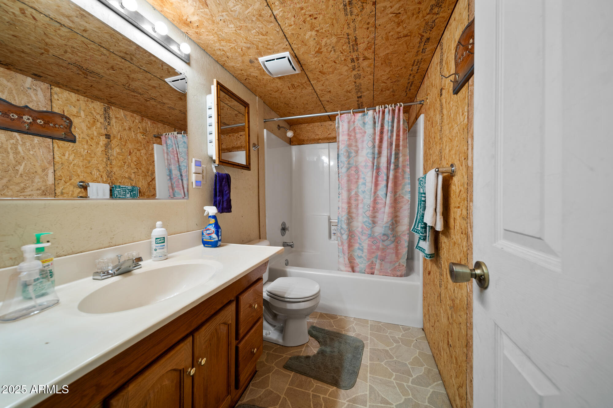 5468 Apache Trail Pinetop, AZ 85935 - Photo 56 of 73 a bathroom with a sink a toilet a mirror and shower