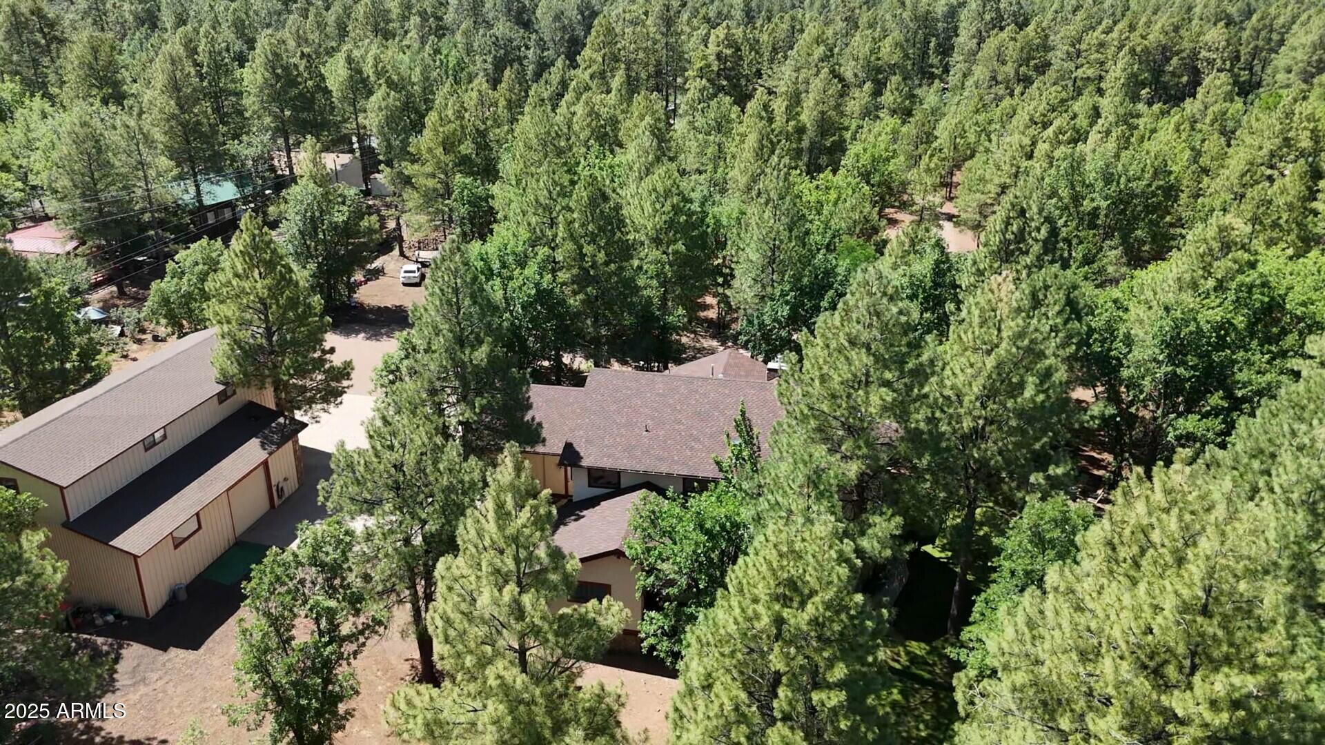 5468 Apache Trail Pinetop, AZ 85935 - Photo 68 of 73 an aerial view of a house with a yard