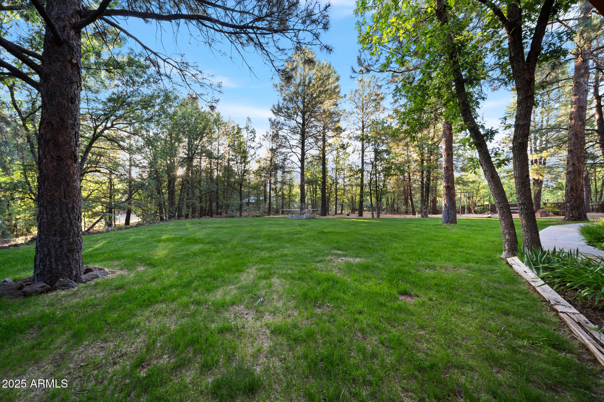 5468 Apache Trail Pinetop, AZ 85935 - Photo 10 of 73 a view of green field with trees in the background