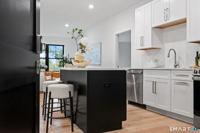 a kitchen with a sink cabinets and window