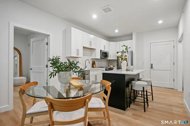 a kitchen with a table and chairs in it
