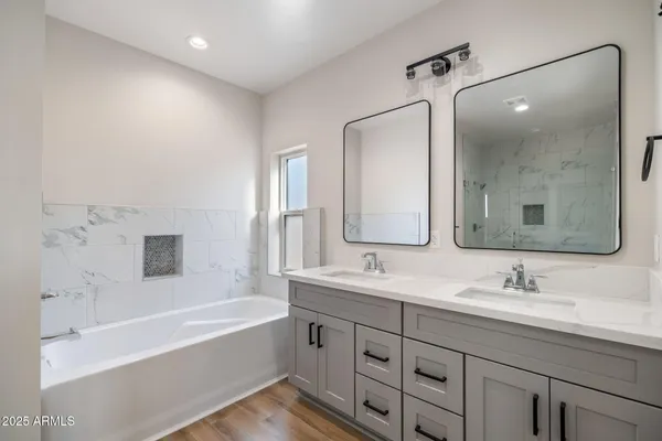 a bathroom with a bathtub and shower