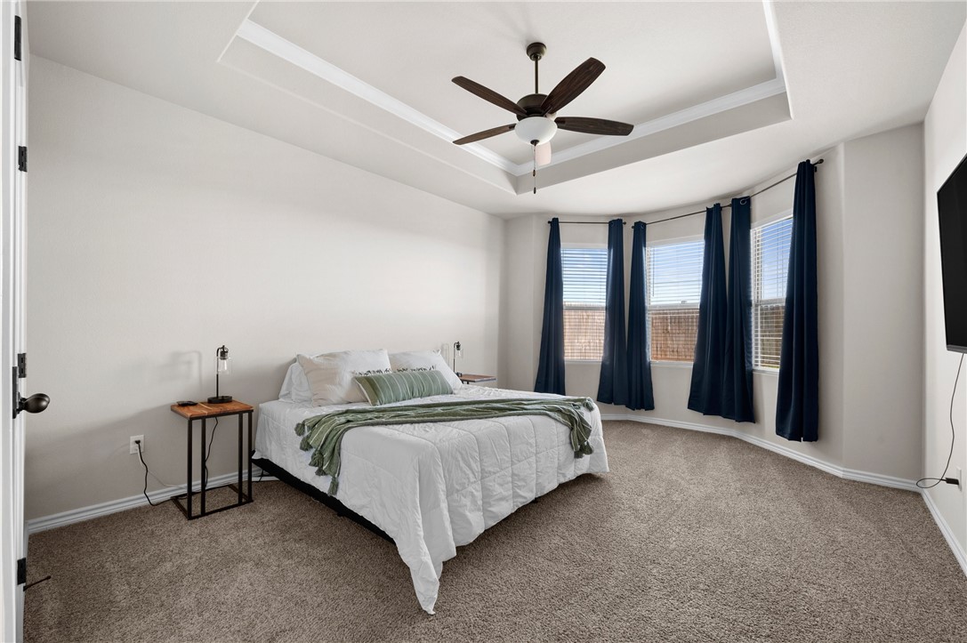 1035 Ocean Breeze Portland, TX 78374 - Photo 17 of 24 a bedroom with a bed and a large window