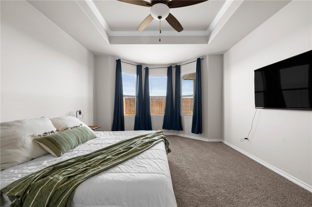 1035 Ocean Breeze Portland, TX 78374 - Photo 18 of 24 a bedroom with a large bed and a flat screen tv