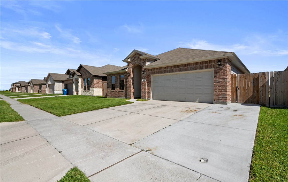 1035 Ocean Breeze Portland, TX 78374 - Photo 2 of 24 a view of a grey house with a yard