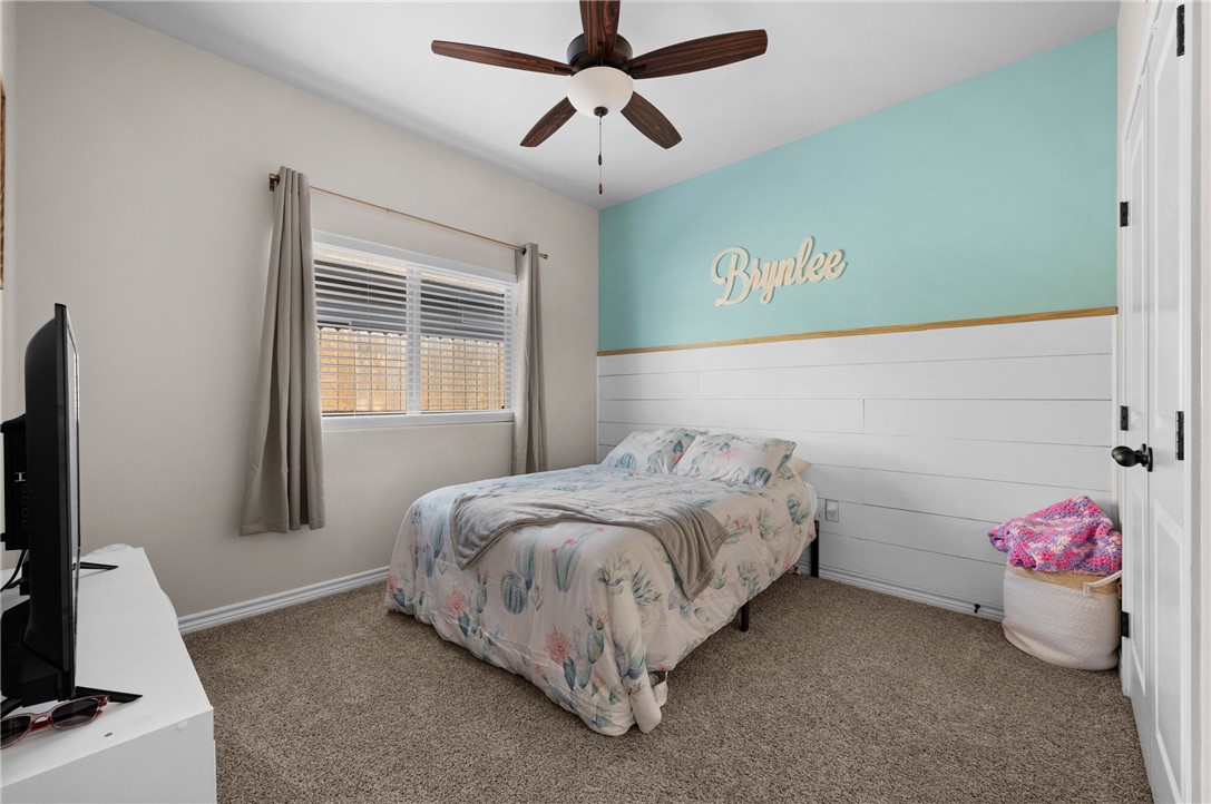 1035 Ocean Breeze Portland, TX 78374 - Photo 4 of 24 a bedroom with a bed and a flat screen tv