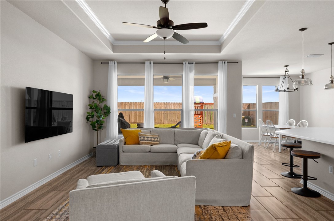 1035 Ocean Breeze Portland, TX 78374 - Photo 9 of 24 a living room with furniture a flat screen tv and a large window