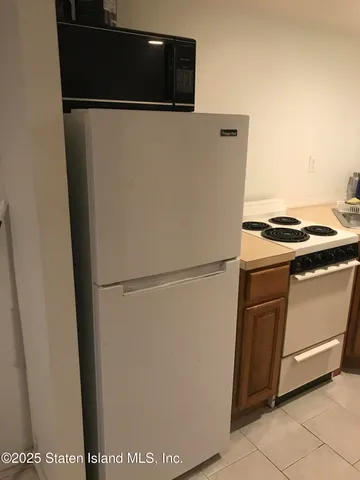a close view of a stove top oven and washer