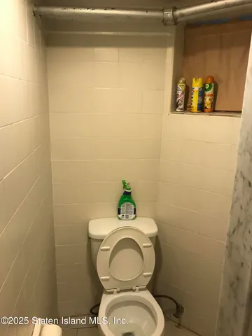 a bathroom with a toilet and a sink