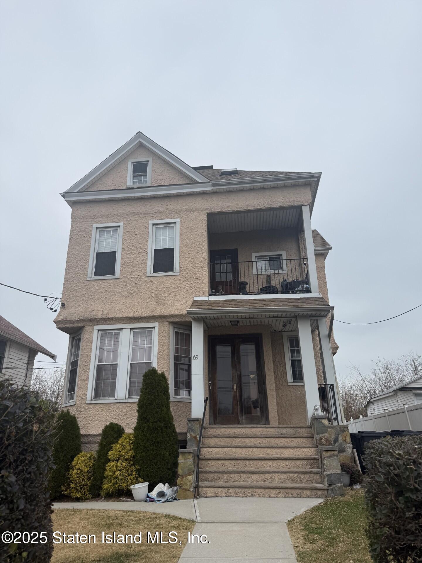 69 Narrows Road North Staten Island, NY 10305 - Photo 2 of 15 a front view of a house