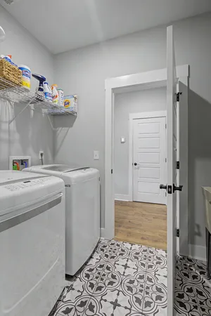 a storage room with cabinets and washer