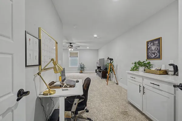 a view of a workspace with furniture