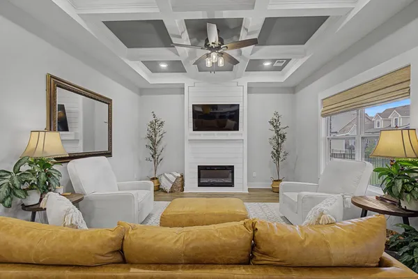 a living room with furniture and a fireplace