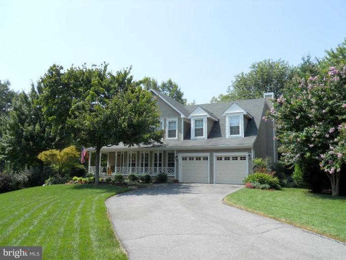 18805 Lindenhouse Road Gaithersburg, MD 20879 - Photo 1 of 1 a front view of a house with garden