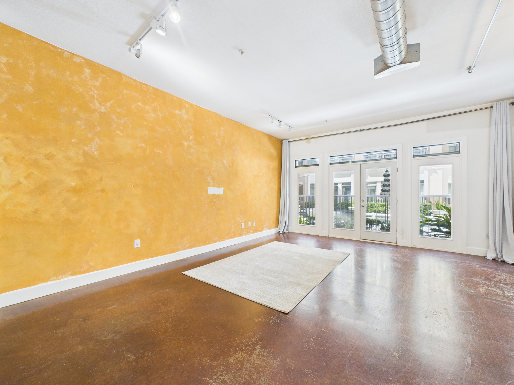 1901 Post Oak Boulevard, Unit 1405 Houston, TX 77056 - Photo 13 of 25 a view of an empty room with wooden floor and a window