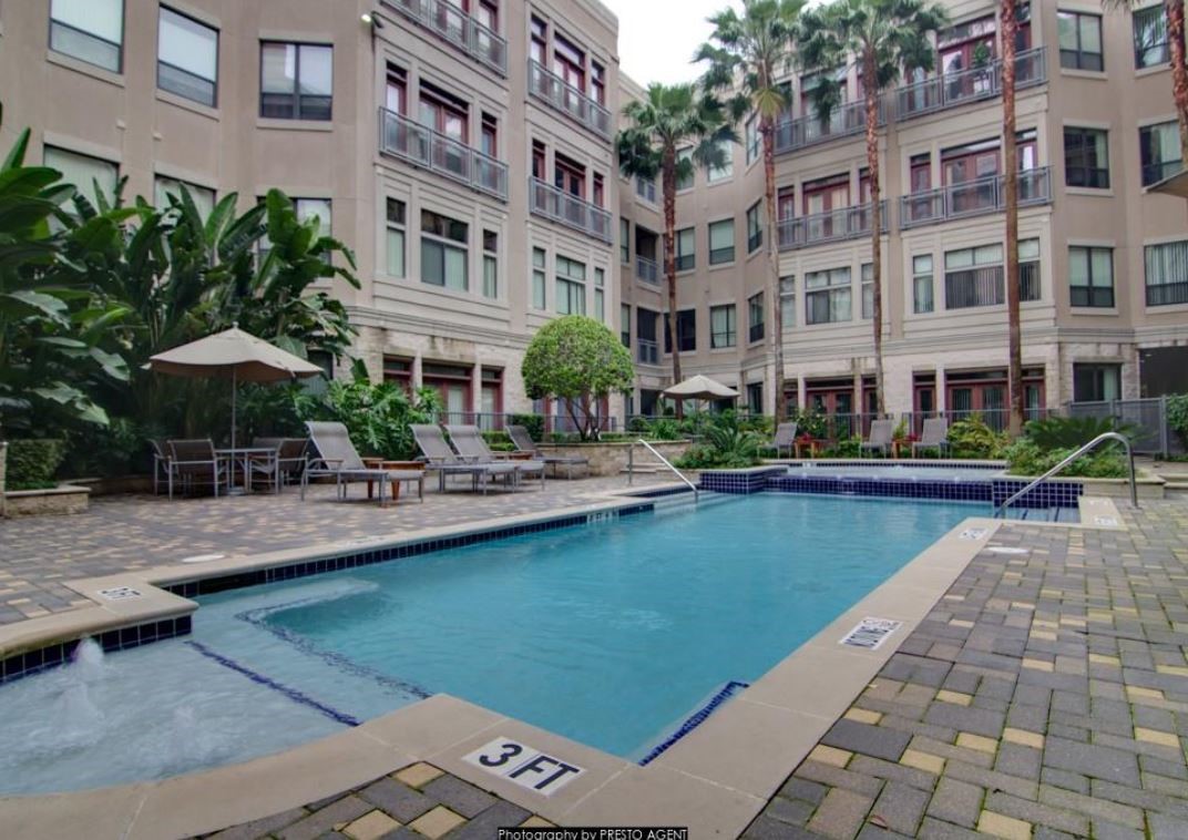 1901 Post Oak Boulevard, Unit 1405 Houston, TX 77056 - Photo 8 of 25 a view of a building with swimming pool