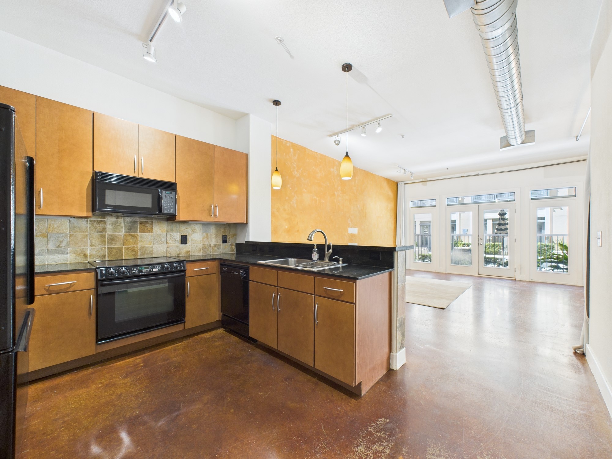 1901 Post Oak Boulevard, Unit 1405 Houston, TX 77056 - Photo 9 of 25 a kitchen with stainless steel appliances granite countertop a stove top oven a sink dishwasher a dining table and chairs with wooden floor
