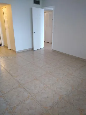 a bathroom with a sink and mirror with toilet