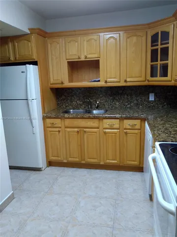 a view of an empty room with a bathroom